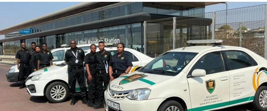 Security officers with marked vehicles outside a bus rapid transit station