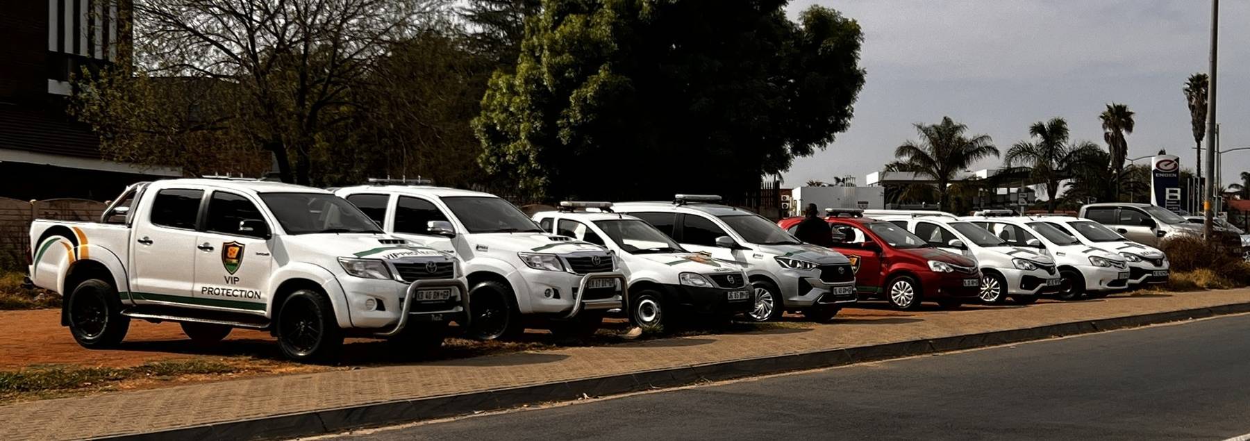 Line of branded 87 Future Enterprises patrol bakkies and sedans