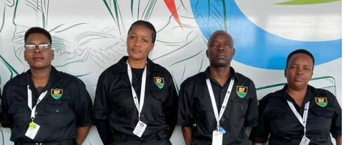 Four 87 Future Enterprises officers in uniform at a City of Ekurhuleni station