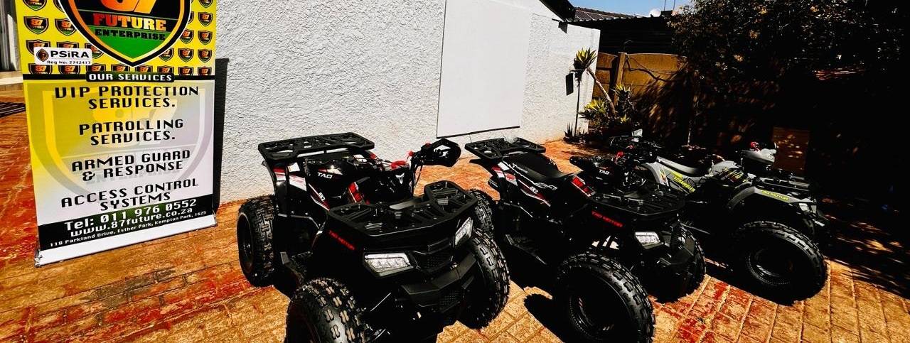 Row of black all-terrain quad bikes