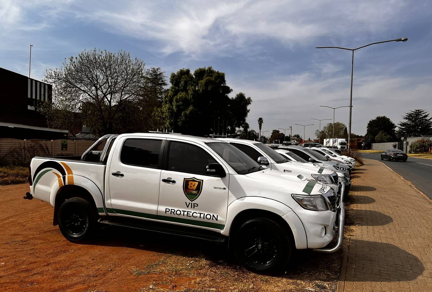 White VIP protection bakkie in company livery